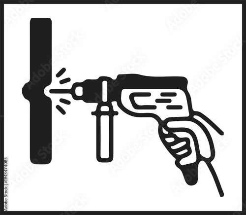 Black and white illustration of a hand holding an electric drill to create a hole in a wall.