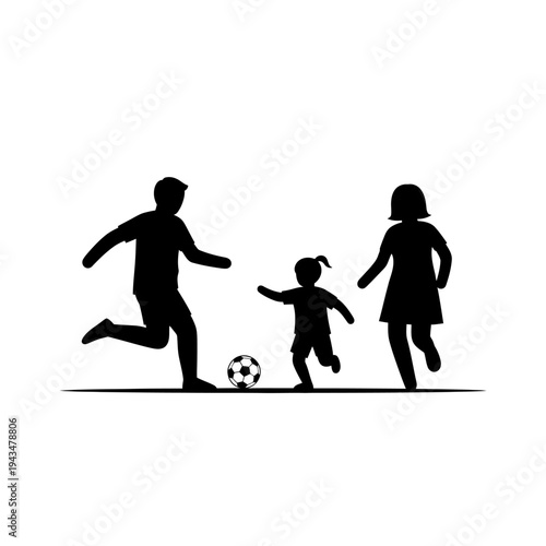 Silhouette of family playing soccer together.