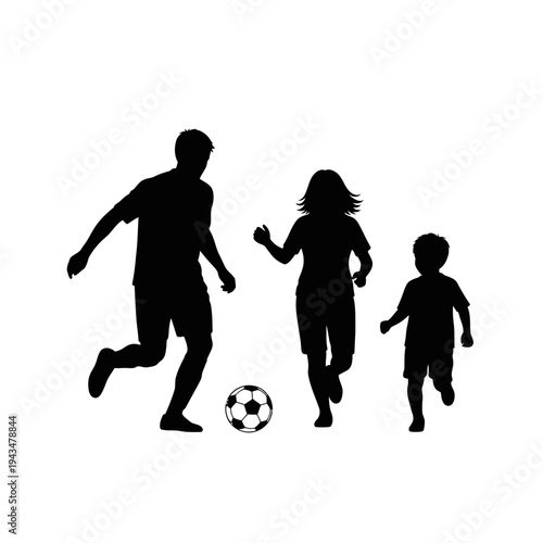 Family playing soccer together outdoors.