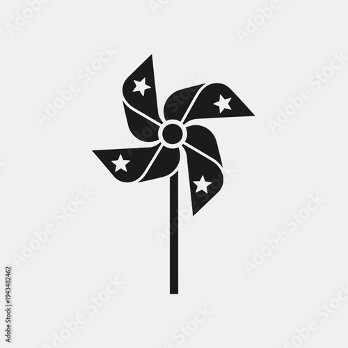 Black pinwheel with white stars on blades.