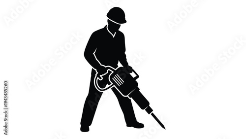 A man in a hard hat using a jackhammer