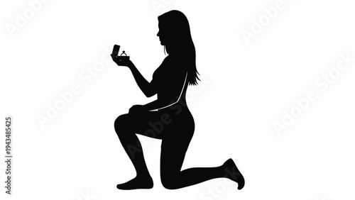 Woman kneeling down and holding a ring