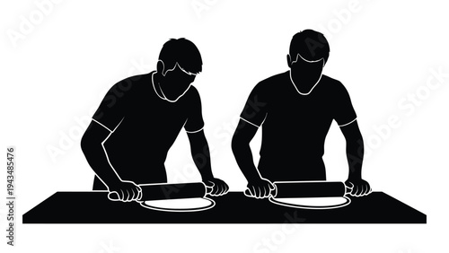 Two men preparing food on a table