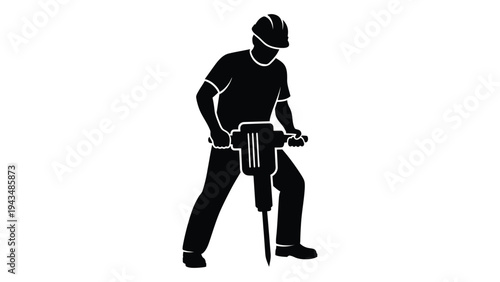 Man in a hard hat operating a jackhammer