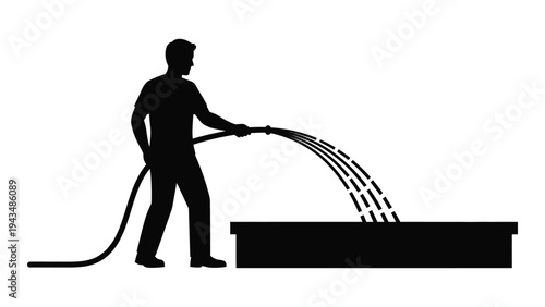 Man watering plants with a hose