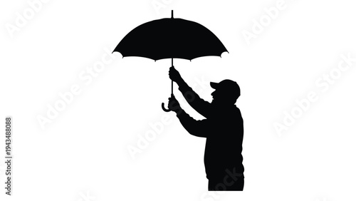 Man holding an umbrella in the wind