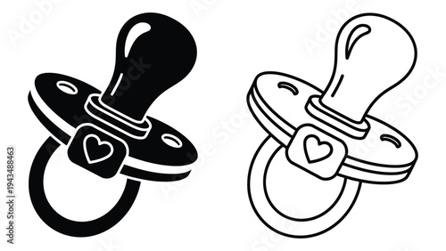 A black and white pacifier with a heart on it