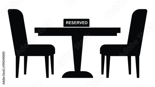 A table and two chairs with a reserved sign