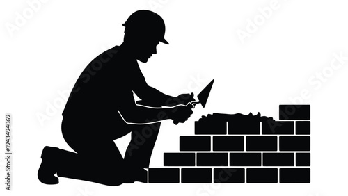 A man laying bricks on a wall