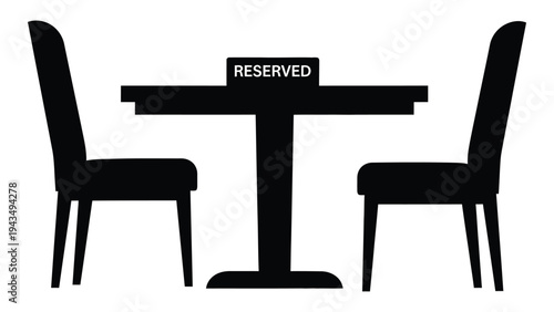 A table and two chairs with a reserved sign on the table