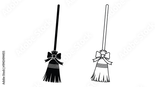 A black and white illustration of two brooms