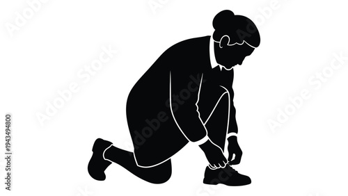 Man kneeling down to tie his shoelace