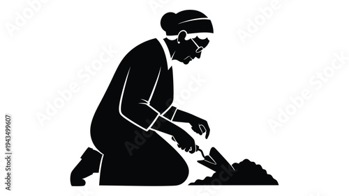 A person kneeling down and working with a tool