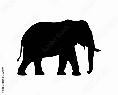 Black silhouette of an elephant walking.