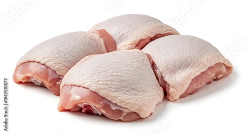 Freshly prepared boneless skinless chicken thighs displayed on a clean surface. boneless chicken thigh