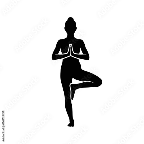 Woman in yoga tree pose silhouette.