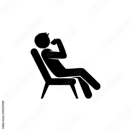 Man sitting in a chair relaxing.