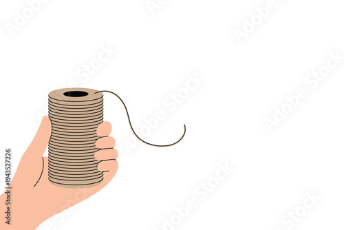 Hand holding large spool of beige string illustration.