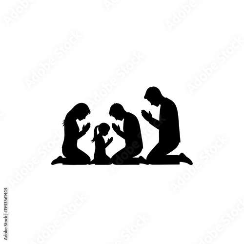 Family in prayer together on knees.