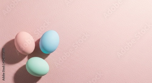 Pastel Easter eggs on pink background with soft shadows