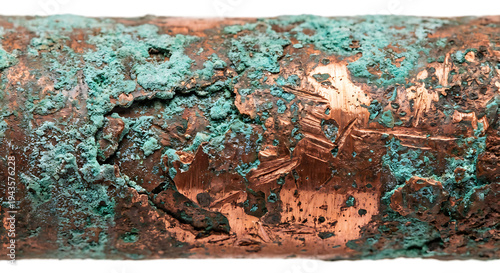 Corroded copper pipe with verdigris patina and industrial oxidation