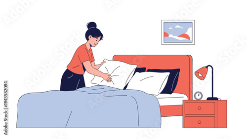 Young woman makes her bed by carefully placing white pillows on the mattress in a bright and cozy bedroom setting.