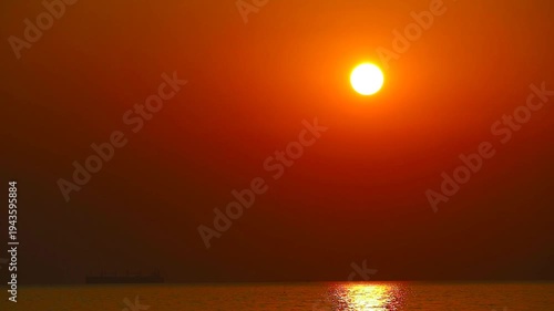 sunset clear dark red sky and sunlight reflection on the sea