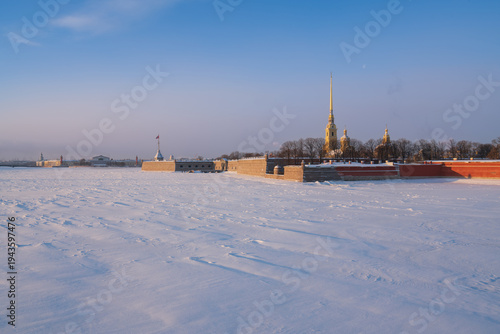 Peter and Paul Fortress and Vasilievsky Island from the Trinity Bridge over the Neva River on a sunny winter morning with clouds, St. Petersburg, Russia
