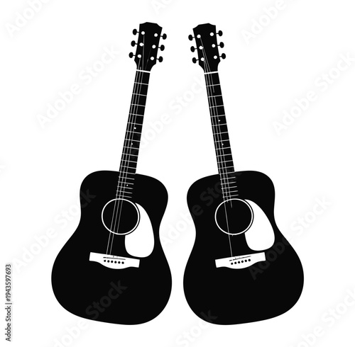 Two black acoustic guitars standing side by side on a white background