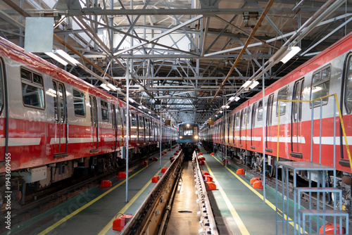Bilde på lerret Metro trains in a depot above a repair pit, industrial front view hangar