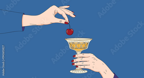 Elegant pair of hands prepare a cocktail by dropping a single red cherry into a glass filled with a golden alcoholic beverage against a blue background.