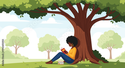 Young black woman sitting under a large leafy tree in a peaceful green park and enjoying her time reading an interesting book.