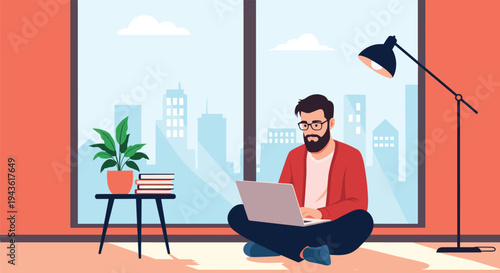 Bearded man sitting on the floor and working on his laptop in a modern apartment with a city view for remote work concept.