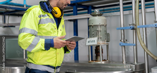 Engineers or factory managers wearing safety helmet inspect the machines in the production line. Utility inspector check machine and test the system to meet the standard. machine, maintenance.