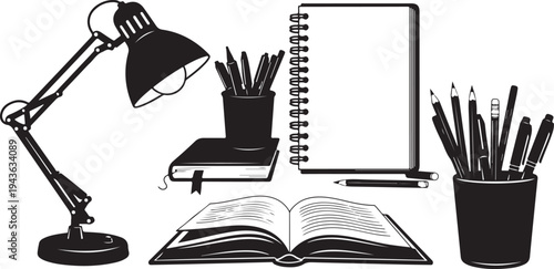 Study desk with lamp, books, and stationery supplies arranged neatly