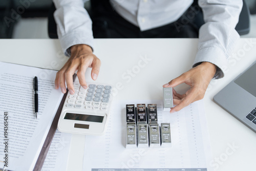 Silver bar Trading business man hand offering silver Investment financial report Trading Pure silver precious metals investment  on the stock exchange Rising prices.