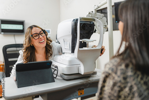Optometrist discussing visual health with patient during eye exam