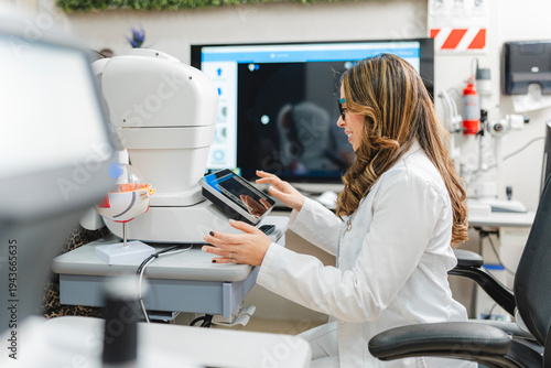 Optometrist conducting modern eye exam using medical equipment