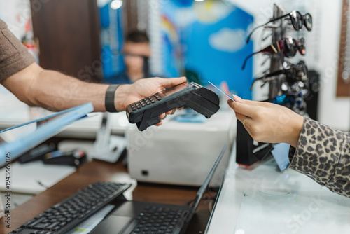 Customer paying for eyewear purchase with credit card