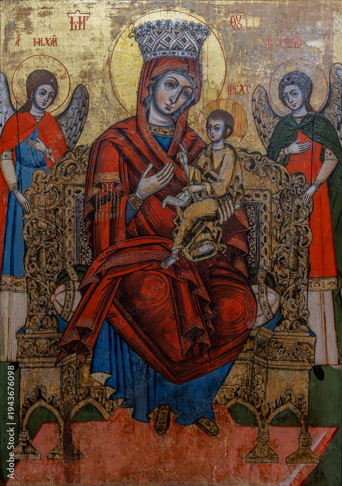 Naklejka premium An old icon representing the Mother of God the Empress with the baby Jesus in her arms, at the Sambata de Sus monastery - Romania