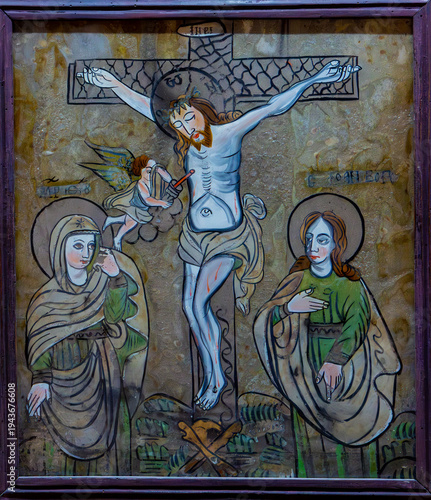An old icon depicting Jesus crucified on the cross, at the Sambata de Sus monastery - Romania
