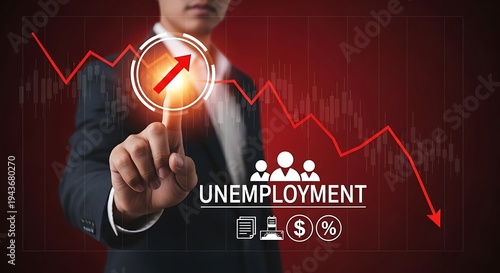 A businessman interacting with a digital graph showing a decline in unemployment rates.