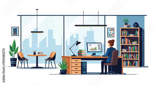 Woman working diligently at her desk in a modern office setting.