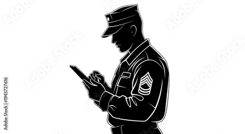 Military serviceman in uniform using a tablet, focused on digital task