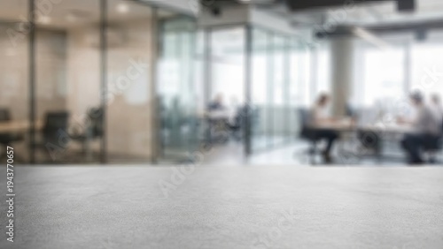 Blurred modern office meeting with glass walls with blurred people working.