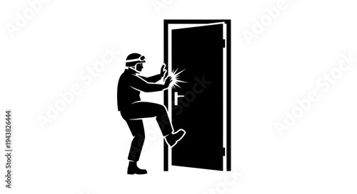 Silhouette of person in hard hat kicking open a door with force