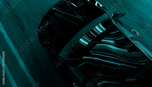 Black sports car driving at high speed on road