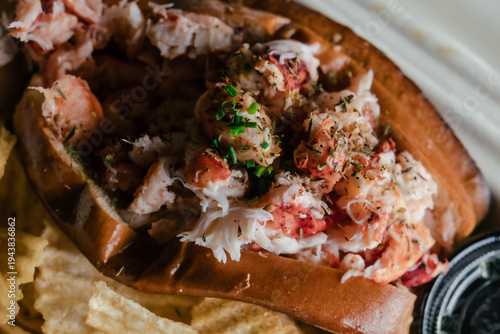 Slika na platnu Lobster roll closeup in soft light