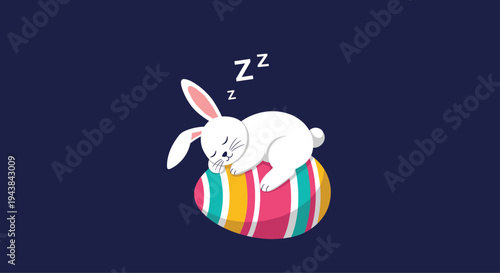 White bunny rabbit sleeping peacefully on top of a large colorful decorated easter egg on a dark background for festive greeting.