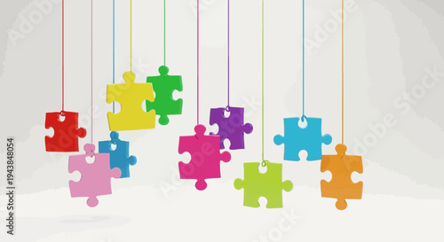 Colorful puzzle pieces hanging from strings in various vibrant colors and shapes
